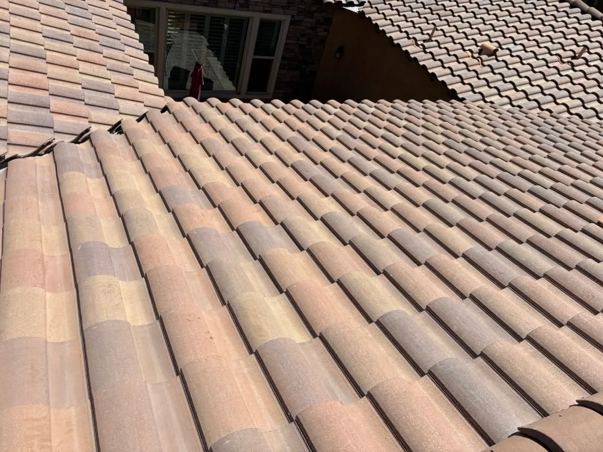 Multi-tone clay barrel tile roof repair and valley integration on an El Cajon home