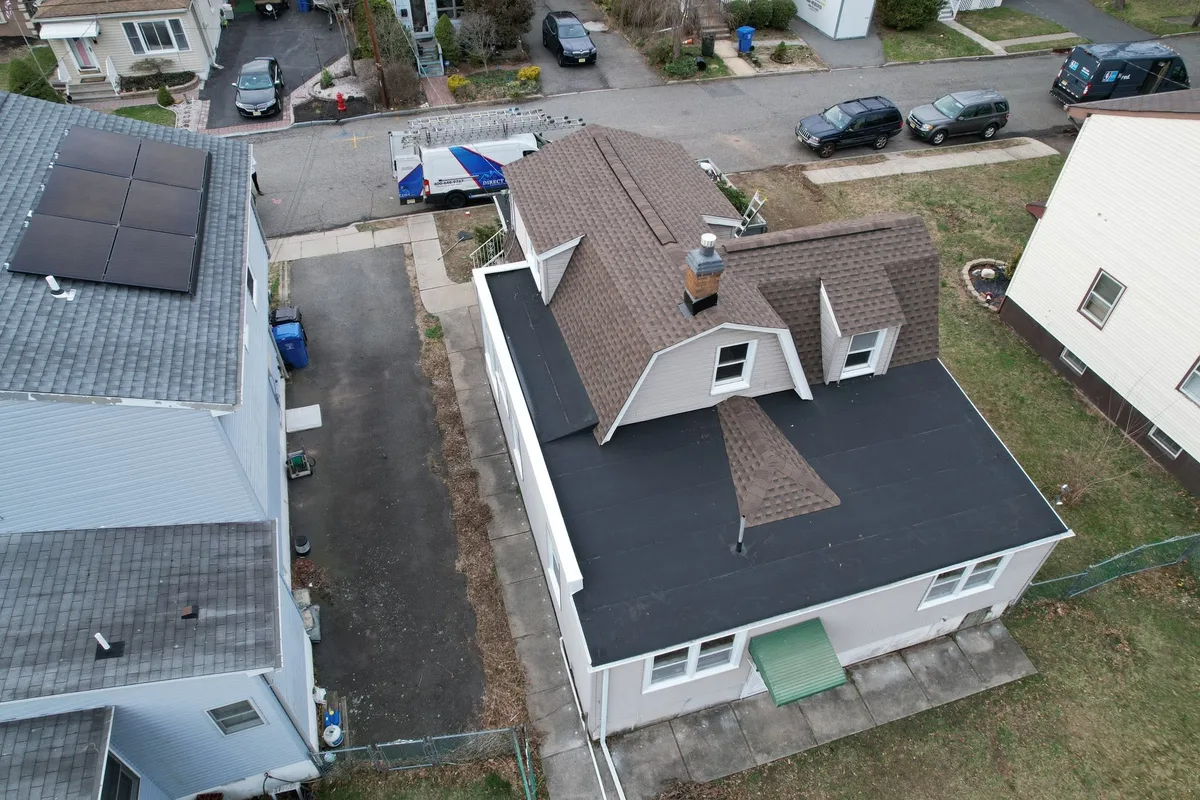 Aerial view of completed architectural shingle and flat roof replacement on an East County residence