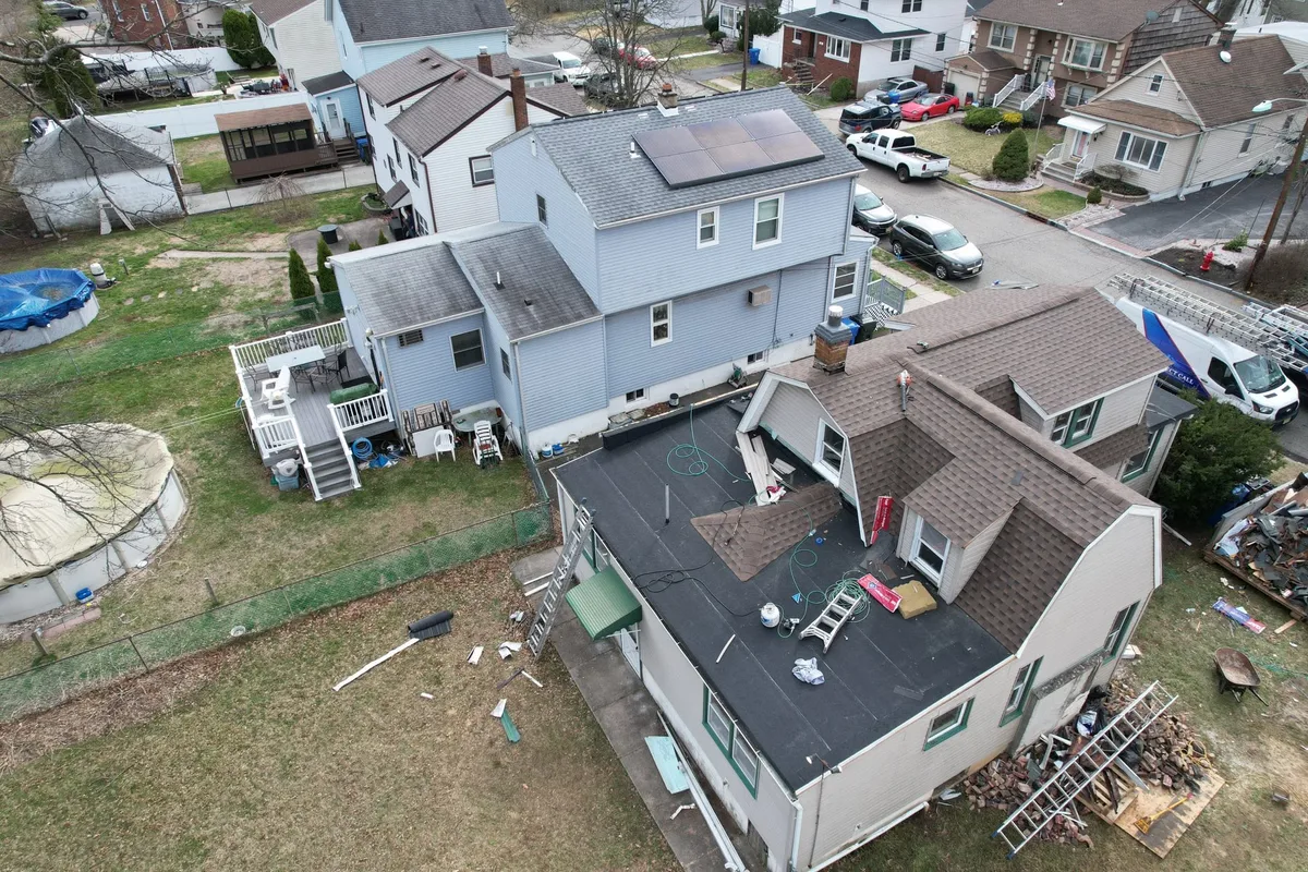 Residential roof tear-off and multi-layer installation in progress in East County San Diego