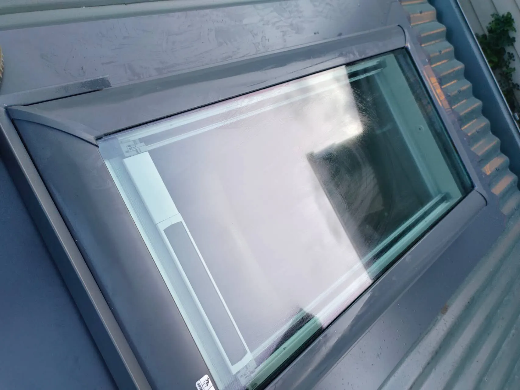 High-performance skylight installation with custom watertight flashing on metal roofing in El Cajon